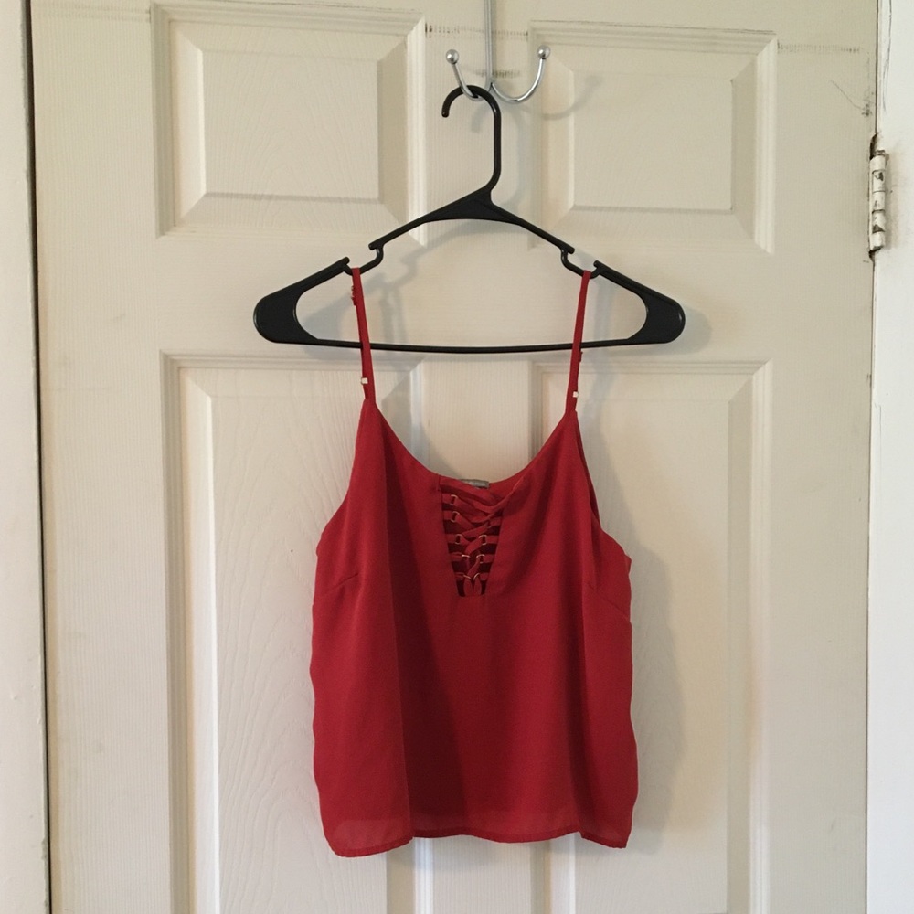 Red with a tint of rust, lace up, tank.